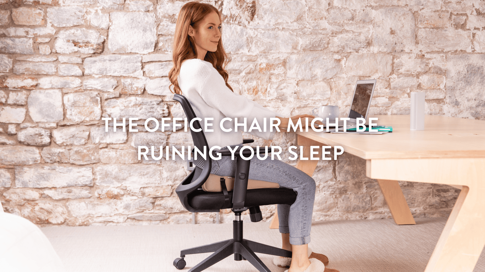 Person sitting at a desk using a Putnams sitting wedge