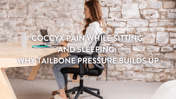 Person sitting at a desk using a Putnams coccyx cushion to relieve tailbone pain 