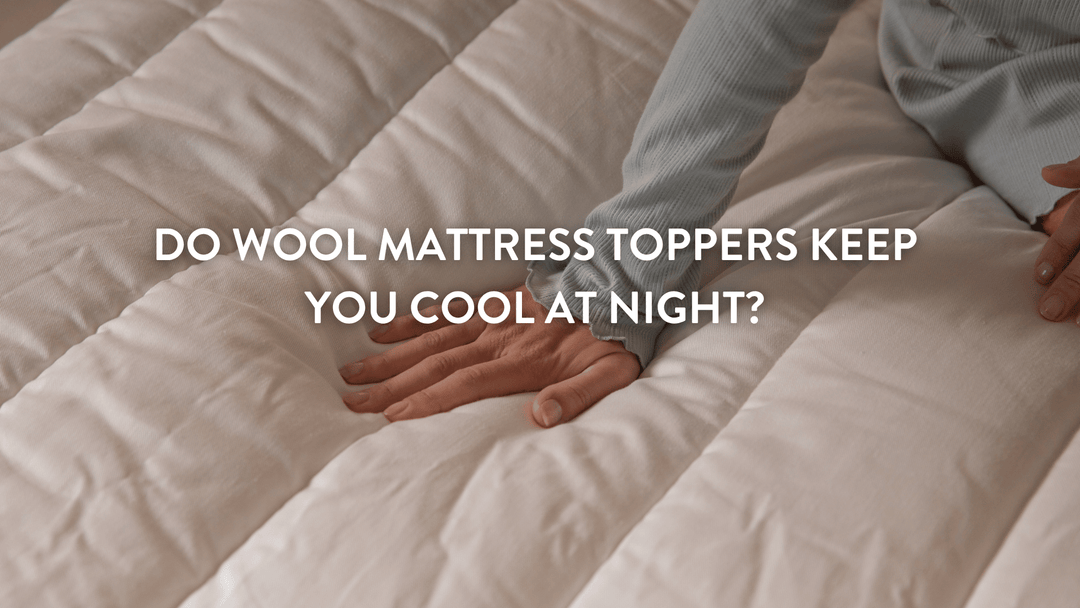 Person pressing down a Putnams British Wool Mattress topper demonstrating the comfort and depth of the product