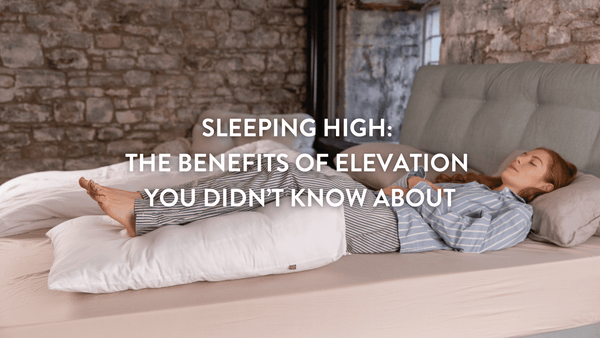 Person lying on bed with their legs elevated on a Putnams bed wedge