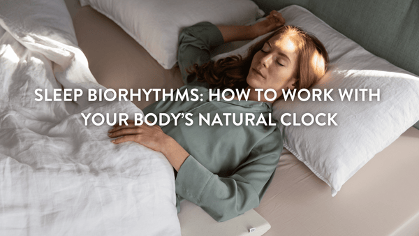 person sleeping on a bed with Putnams pillows 