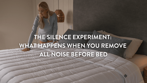 person making up a double bed with a Putnams 100% white wool duvet