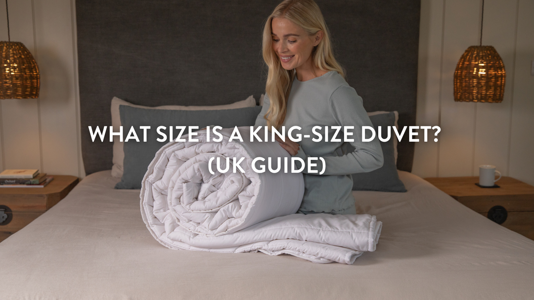 Person unrolling a Putnams king-size duvet on a king-size bed 