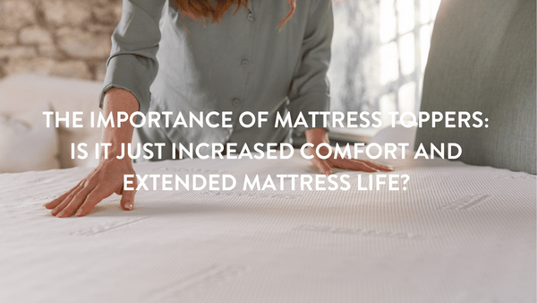 Person pressing down on a Putnams Mattress topper