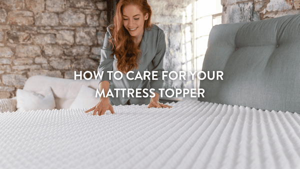 Person checking the Putnams Ripple Mattress Topper