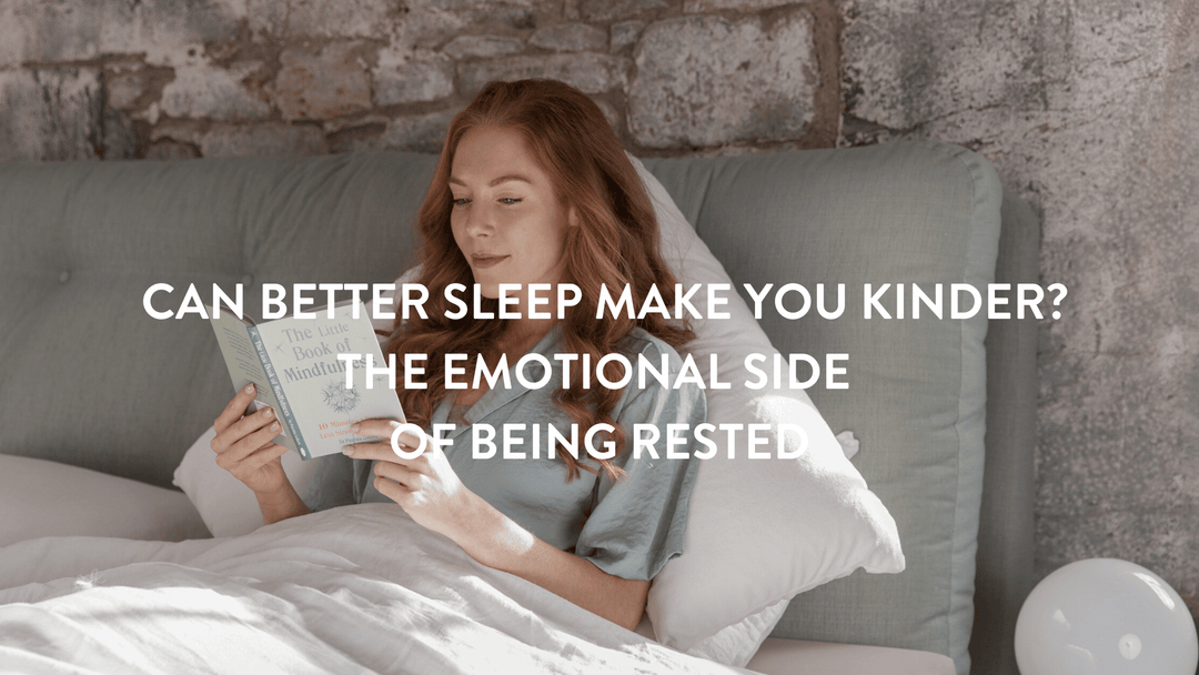 Person sitting up in bed reading the Little Book of Mindfulness 