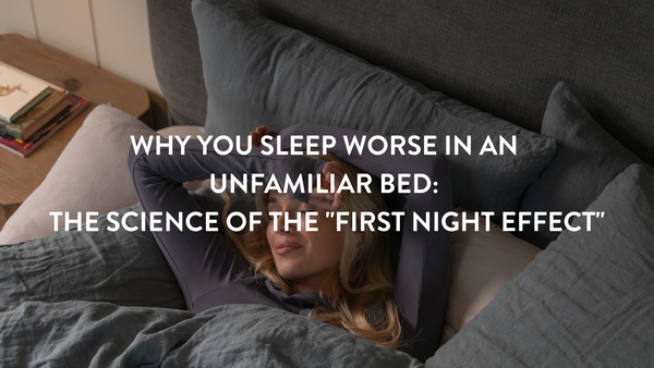 Person struggling to sleep in a new bed in a hotel
