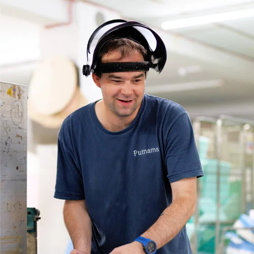 Uk manufacturing employee cutting foam for cushions