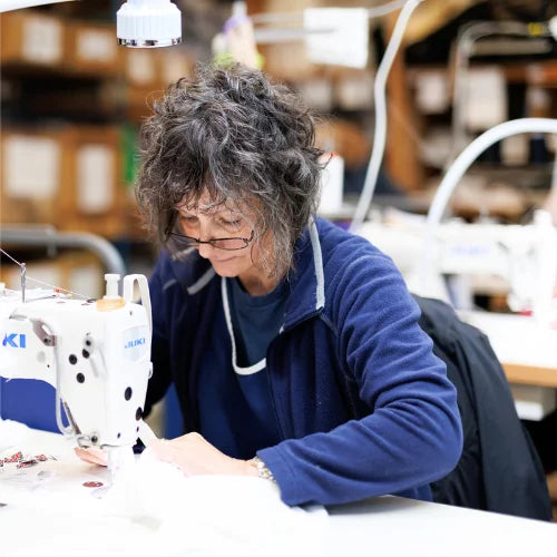 manufacturing employee uk sewing machine making pillows